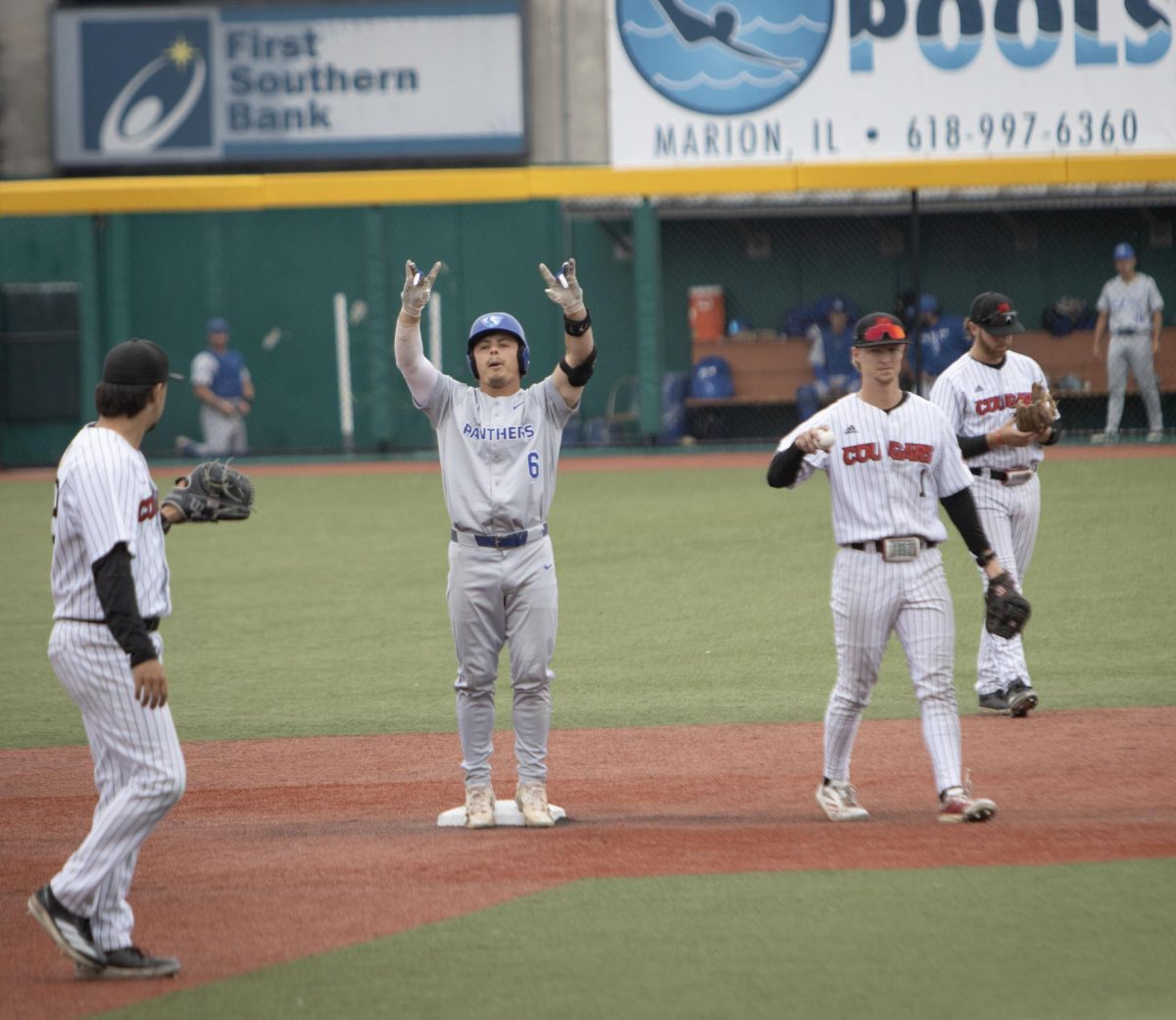 Eastern Illinois University graduate left fielder Brett Stanley celebrates with his dugout during Eastern’s 3-2 win over Southern Illinois Edwardsville in the Ohio Valley Conference tournament.