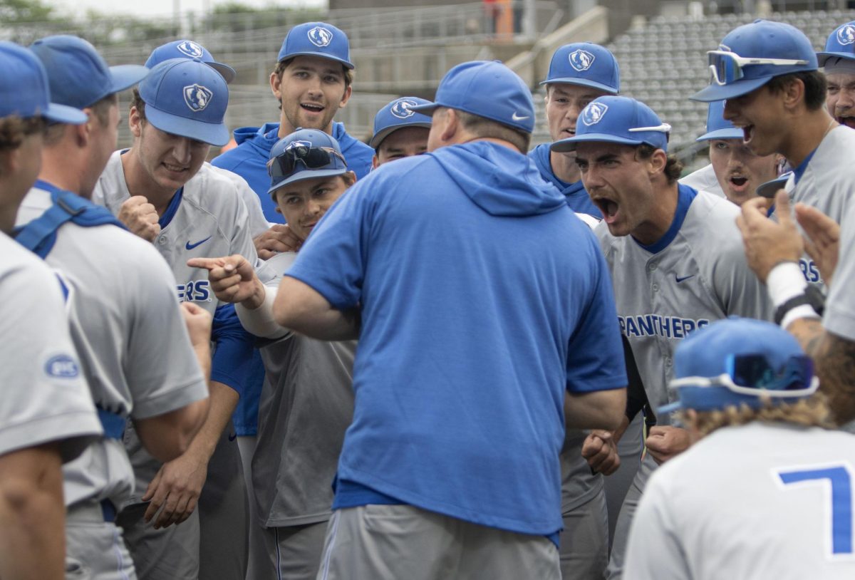 Eastern Illinois University head coach Jason Anderson huddles up with his team after Eastern’s 3-2 win over Southern Illinois Edwardsville in the Ohio Valley Conference tournament.