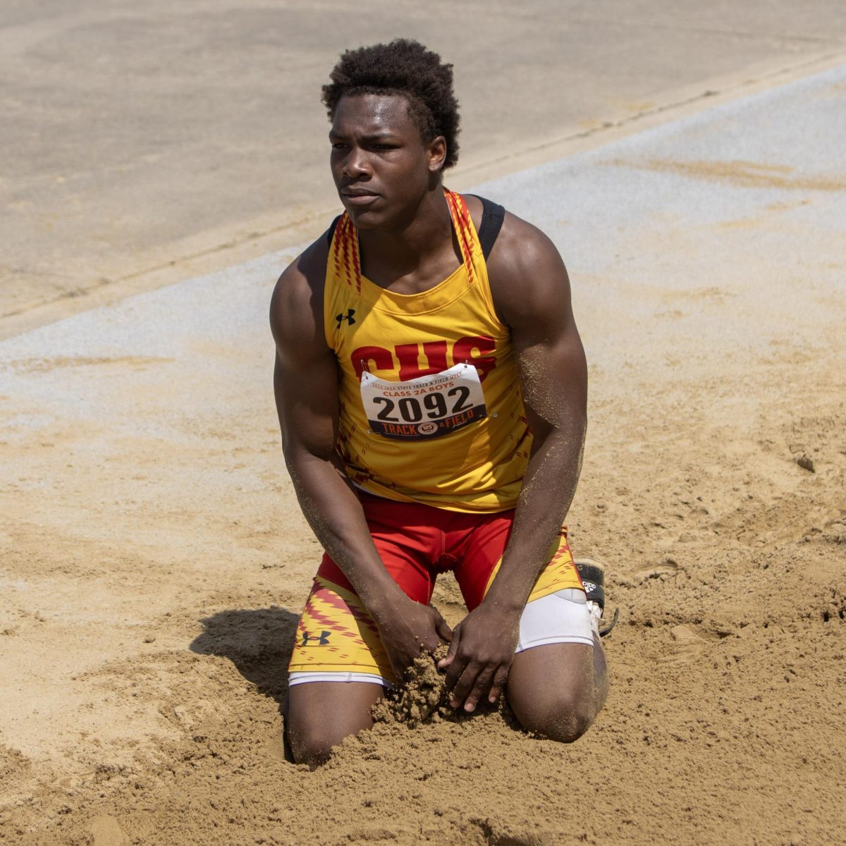 Charleston high school junior Treylin Couch sits on both knees in the sandpit after the class 2A triple jump at the IHSA Boys Track & Field State Meet at O’Brien Field on the EIU campus in Charleston, Ill. on Friday May 29, 2026.