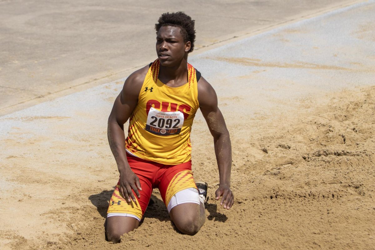 Charleston high school junior Treylin Couch sits on both knees in the sandpit after the class 2A triple jump at the IHSA Boys Track & Field State Meet at O’Brien Field on the EIU campus in Charleston, Ill. on Friday May 29, 2026.